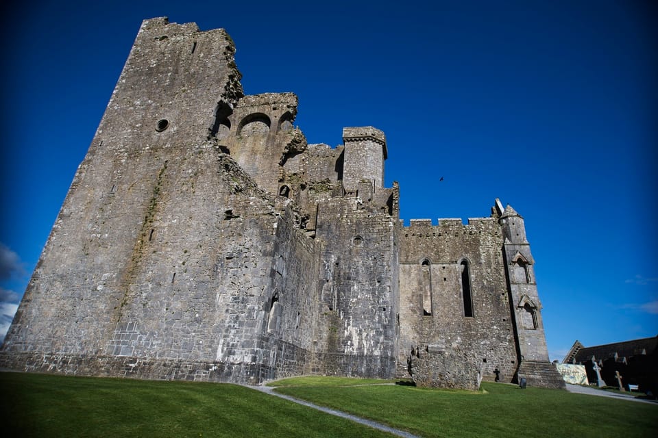 From Dublin:Cork,Cahir Castle,Rock of Cashel Tour in Spanish - Rock of Cashel: medieval buildings stacked on one dramatic rock